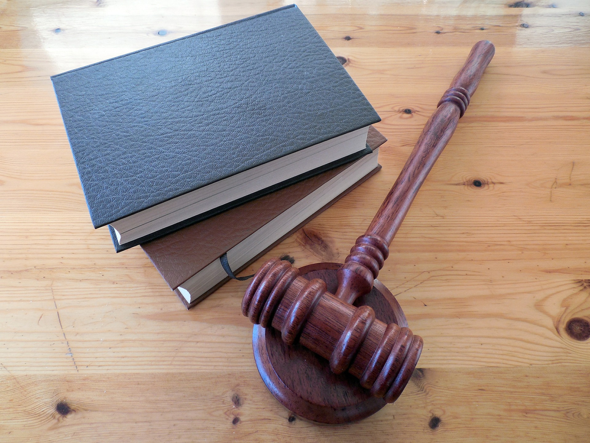 An image showing books and hammer of law
