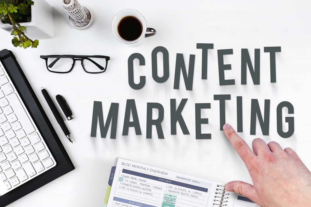 Content Marketing, pen, laptop, notepad